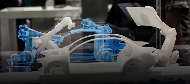 ein 3D-Modell eines Autos vor einem Hologramm desselben
