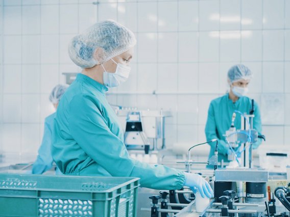 Healthcare staff working on the capsule packaging line