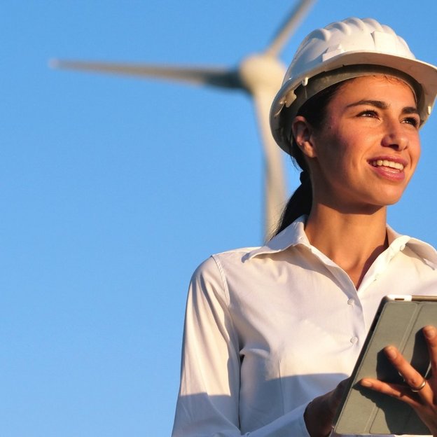 Engineer in front of wind turbine