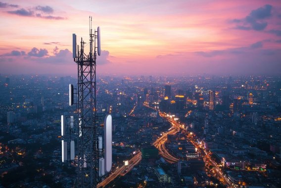 Transmission tower in front of metropolitan panorama