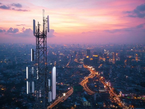 Transmission tower in front of metropolitan panorama