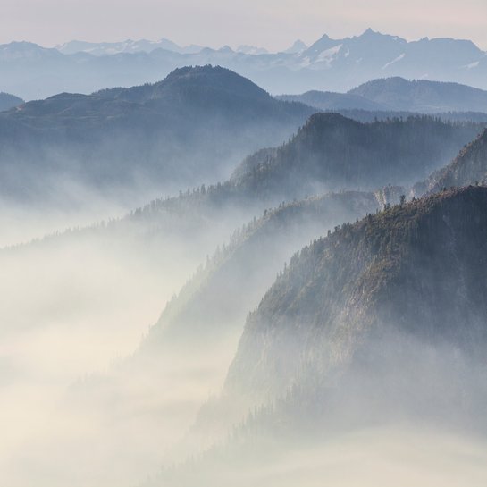 A mountain range surrounded by emissions