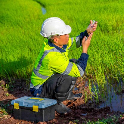 An inspection engineer assessing a water sample at a rice field that is undergoing verification under the Article 6.4 Mechanism. An inspection engineer assessing a water sample at a rice field that is undergoing verification under the Article 6.4 Mechanism.