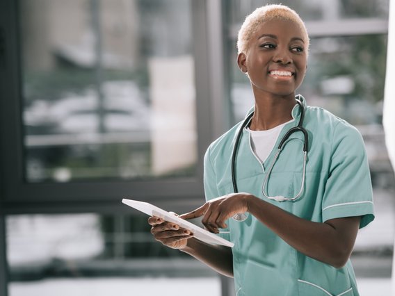 A doctor working in healthcare is smiling. A doctor working in healthcare is smiling.