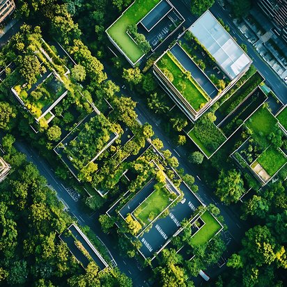 Luftaufnahme moderner Gebäude mit begrünten Dächern inmitten urbaner Bäume