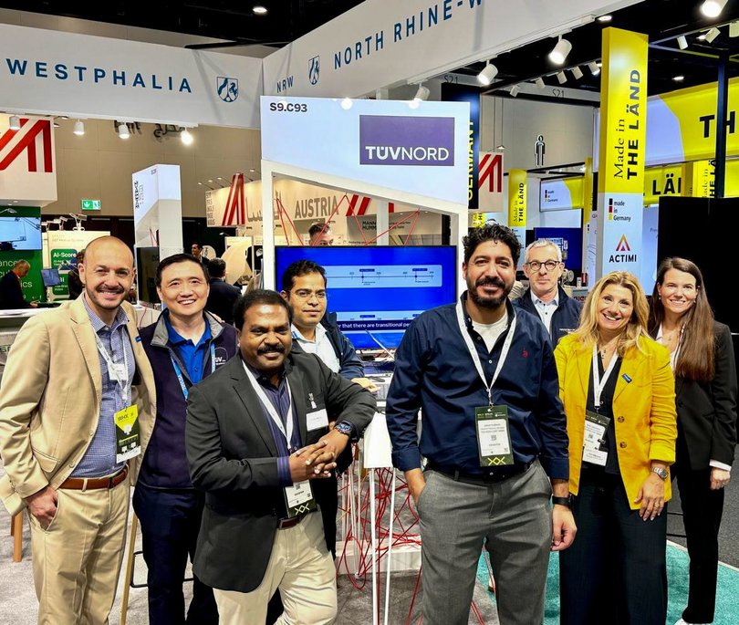 TÜV NORD employees at the TÜV NORD booth during the World Health Expo (WHX) in Dubai