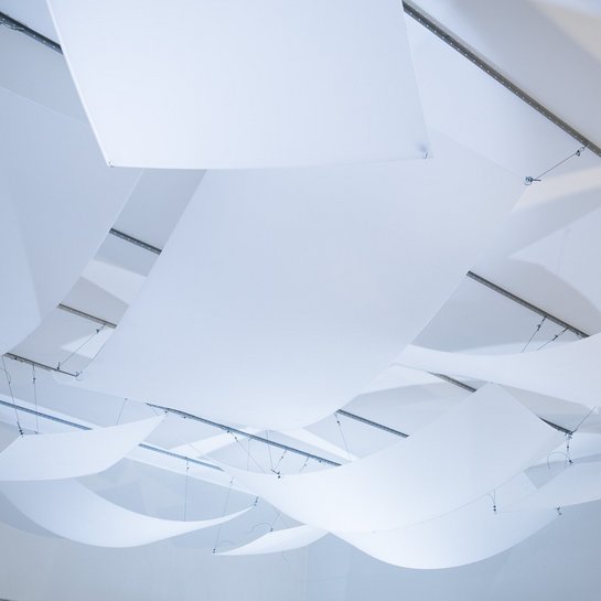 Acoustic panels hanging from the ceiling