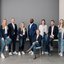 TÜV NORD PartnerManagement-Teamfoto in einem modernen Büro