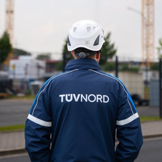 TÜV inspector looks at construction site