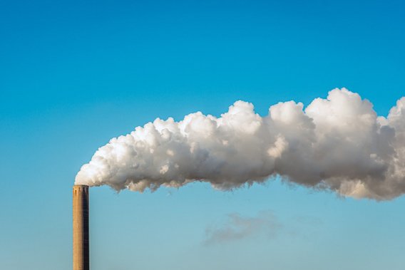 Emissions rise from a factory chimney. Emissions rise from a factory chimney.
